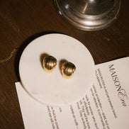 Bouclles montclair mise en scène acier inoxydable